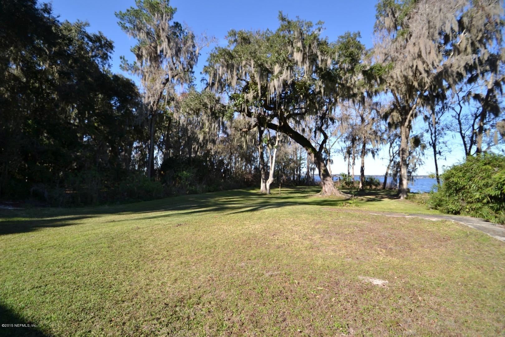 76 Harmony Hall Road Middleburg, FL 32068 - Photo 14 of 67 a view of a swimming pool with an outdoor space and seating area
