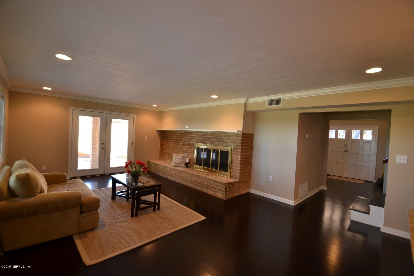 76 Harmony Hall Road Middleburg, FL 32068 - Photo 31 of 67 a living room with furniture and a fireplace