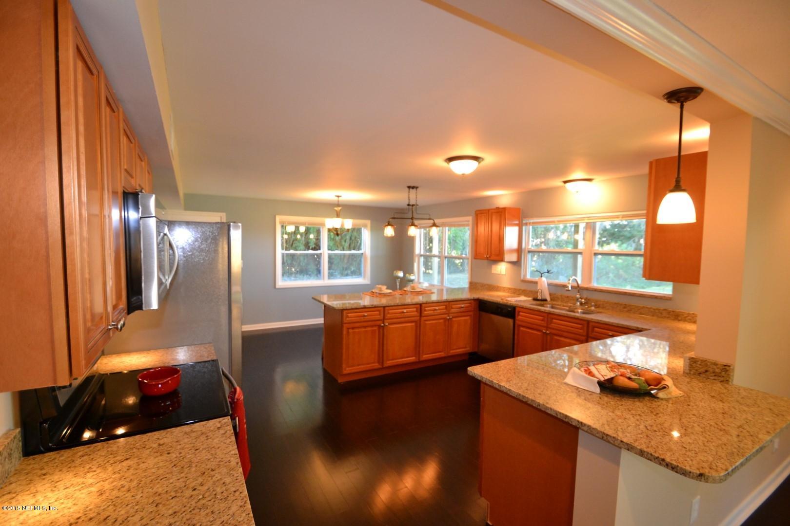 76 Harmony Hall Road Middleburg, FL 32068 - Photo 33 of 67 a dining room with furniture and wooden floor
