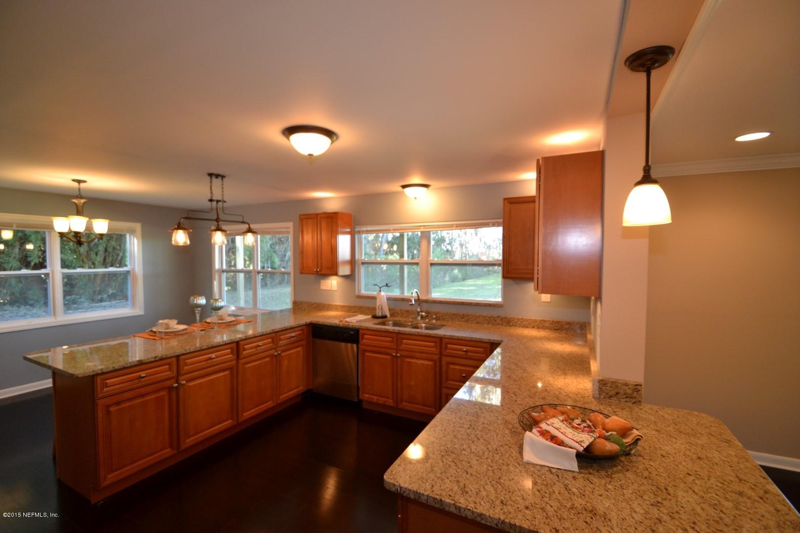 76 Harmony Hall Road Middleburg, FL 32068 - Photo 34 of 67 a large kitchen with lots of counter space