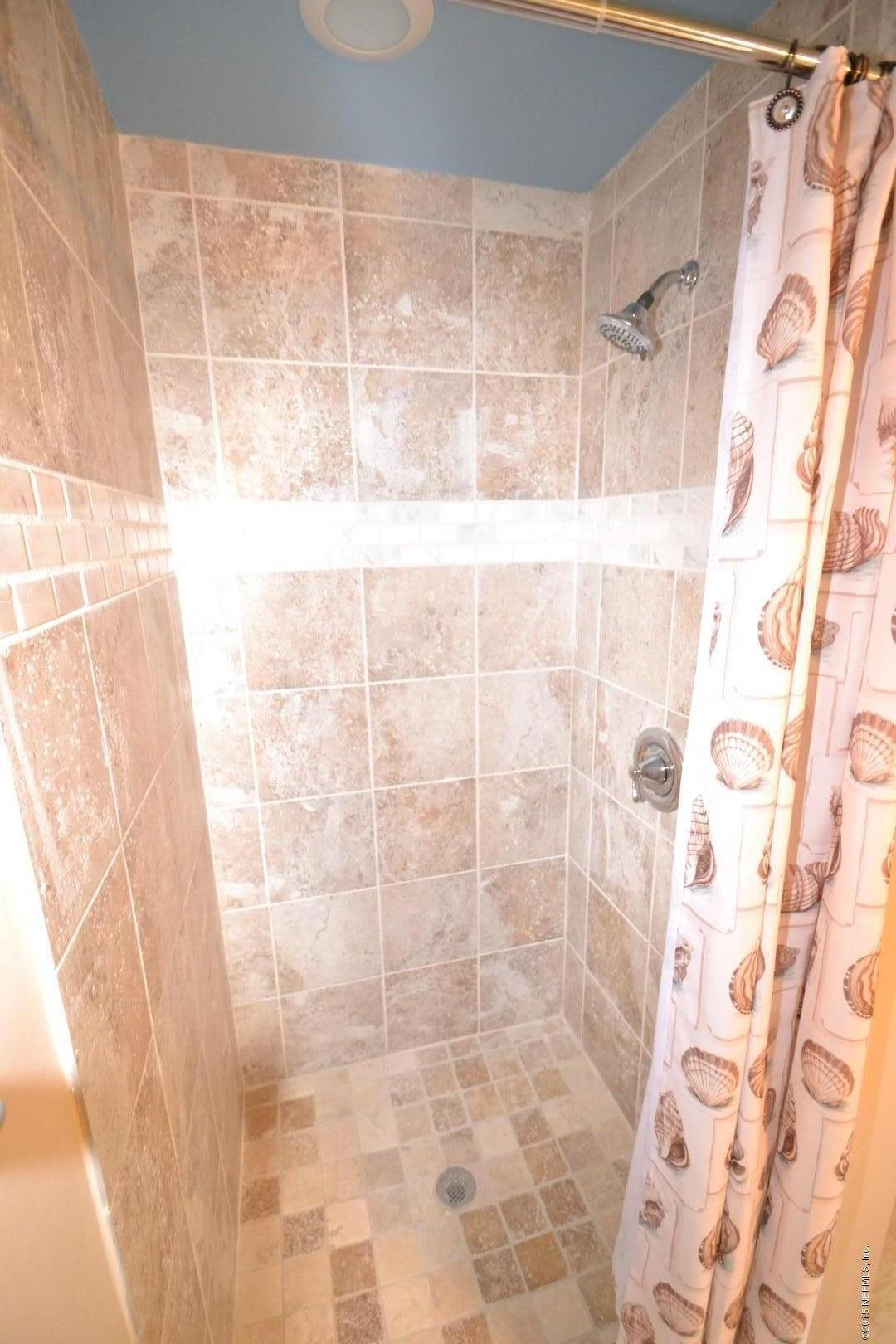 76 Harmony Hall Road Middleburg, FL 32068 - Photo 41 of 67 a bathroom with a shower