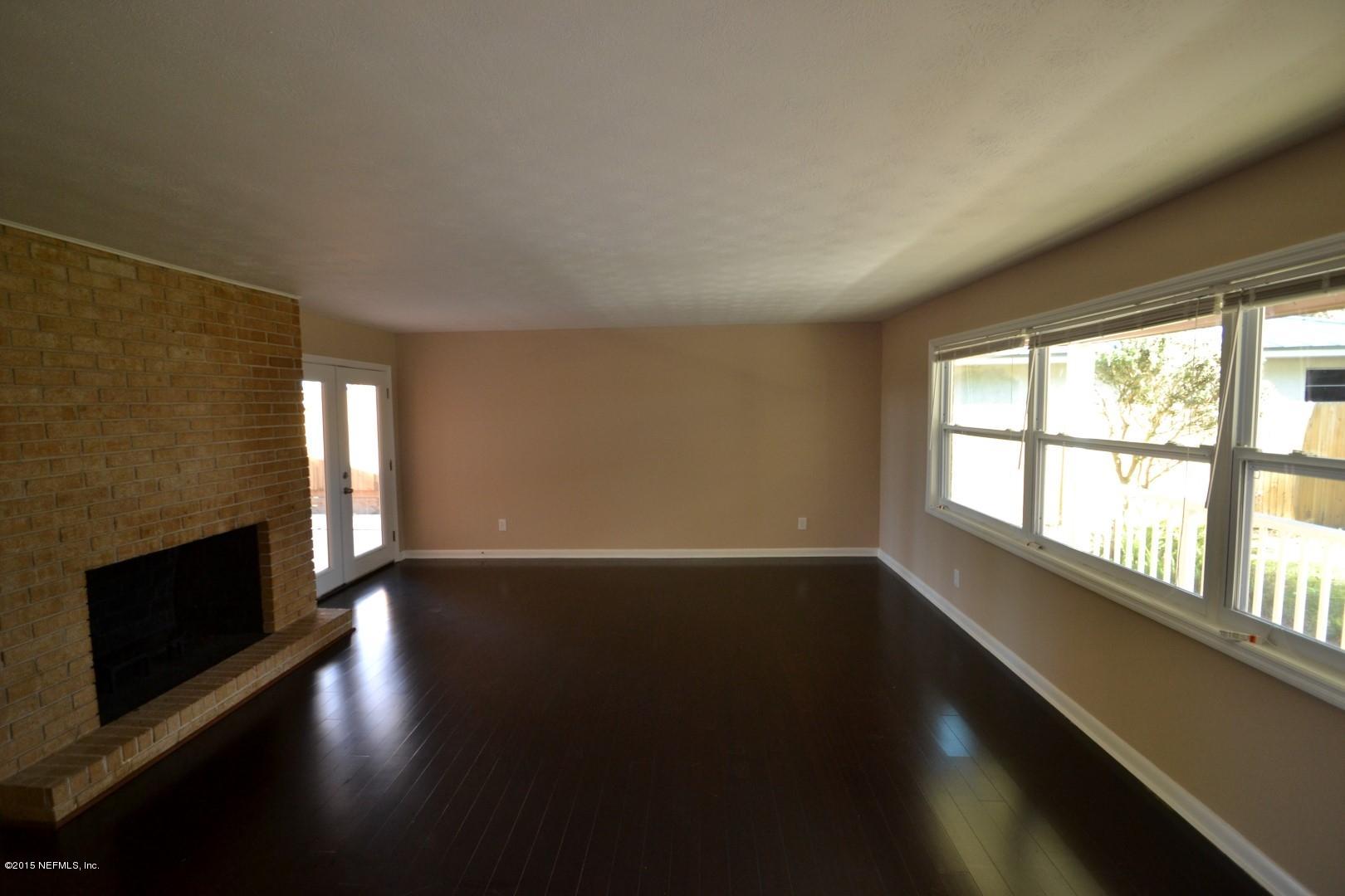 76 Harmony Hall Road Middleburg, FL 32068 - Photo 44 of 67 a view of an empty room with wooden floor and a window