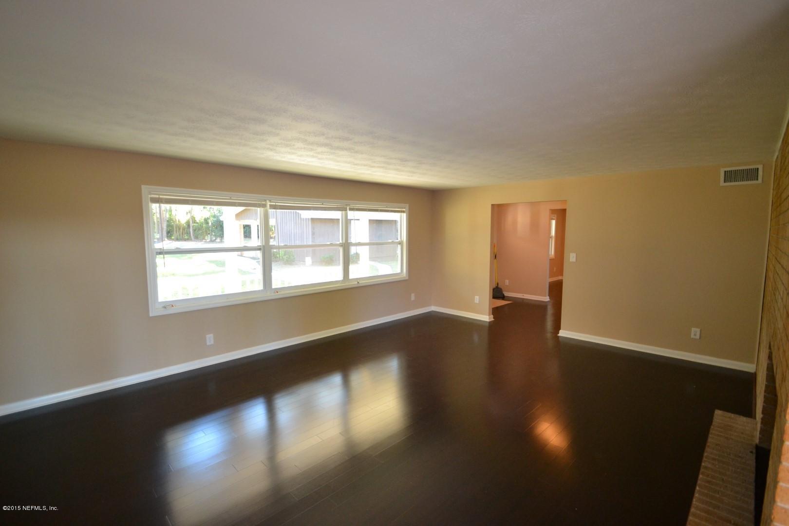 76 Harmony Hall Road Middleburg, FL 32068 - Photo 46 of 67 a view of an empty room with wooden floor and a window