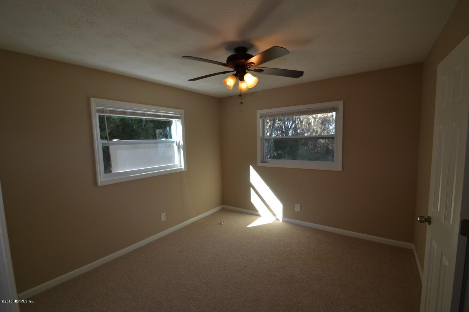 76 Harmony Hall Road Middleburg, FL 32068 - Photo 53 of 67 a view of a livingroom with a ceiling fan and window