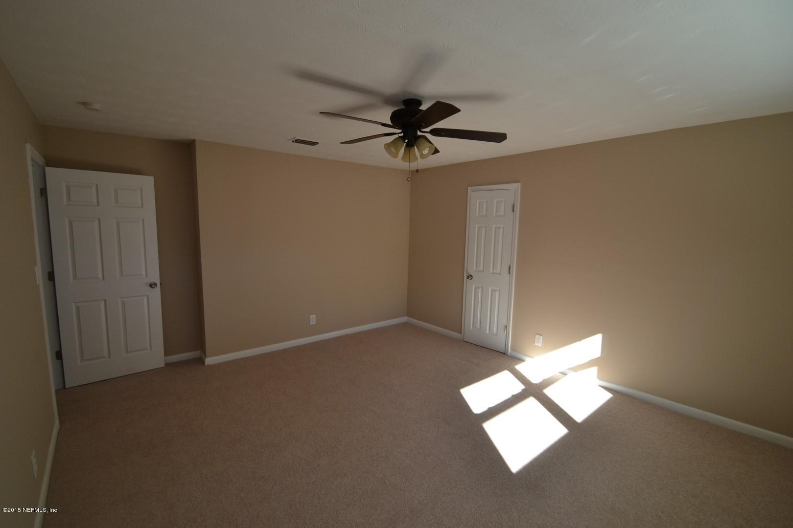 76 Harmony Hall Road Middleburg, FL 32068 - Photo 58 of 67 a view of empty room with windows
