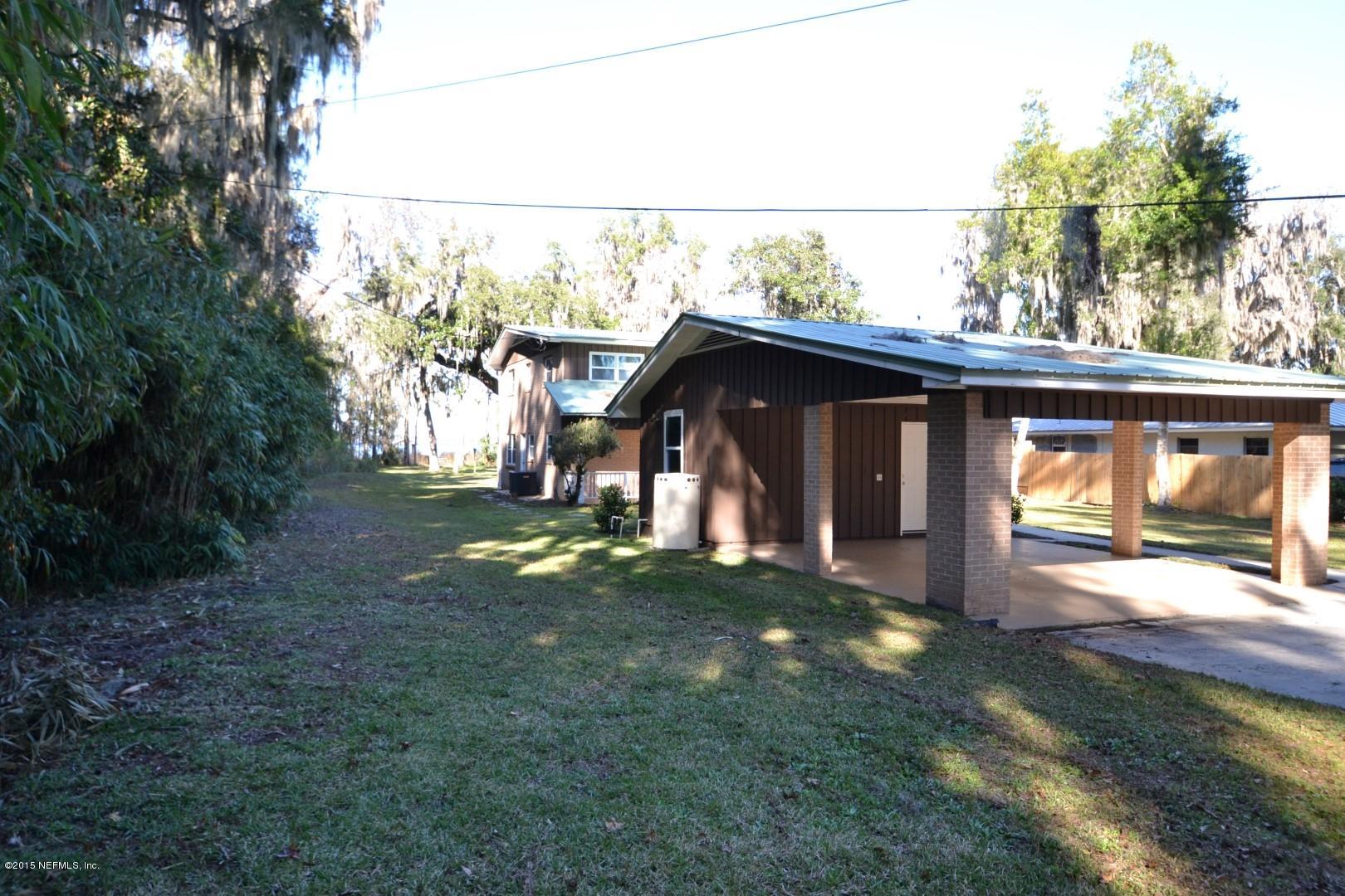 76 Harmony Hall Road Middleburg, FL 32068 - Photo 8 of 67 a view of a house with a yard