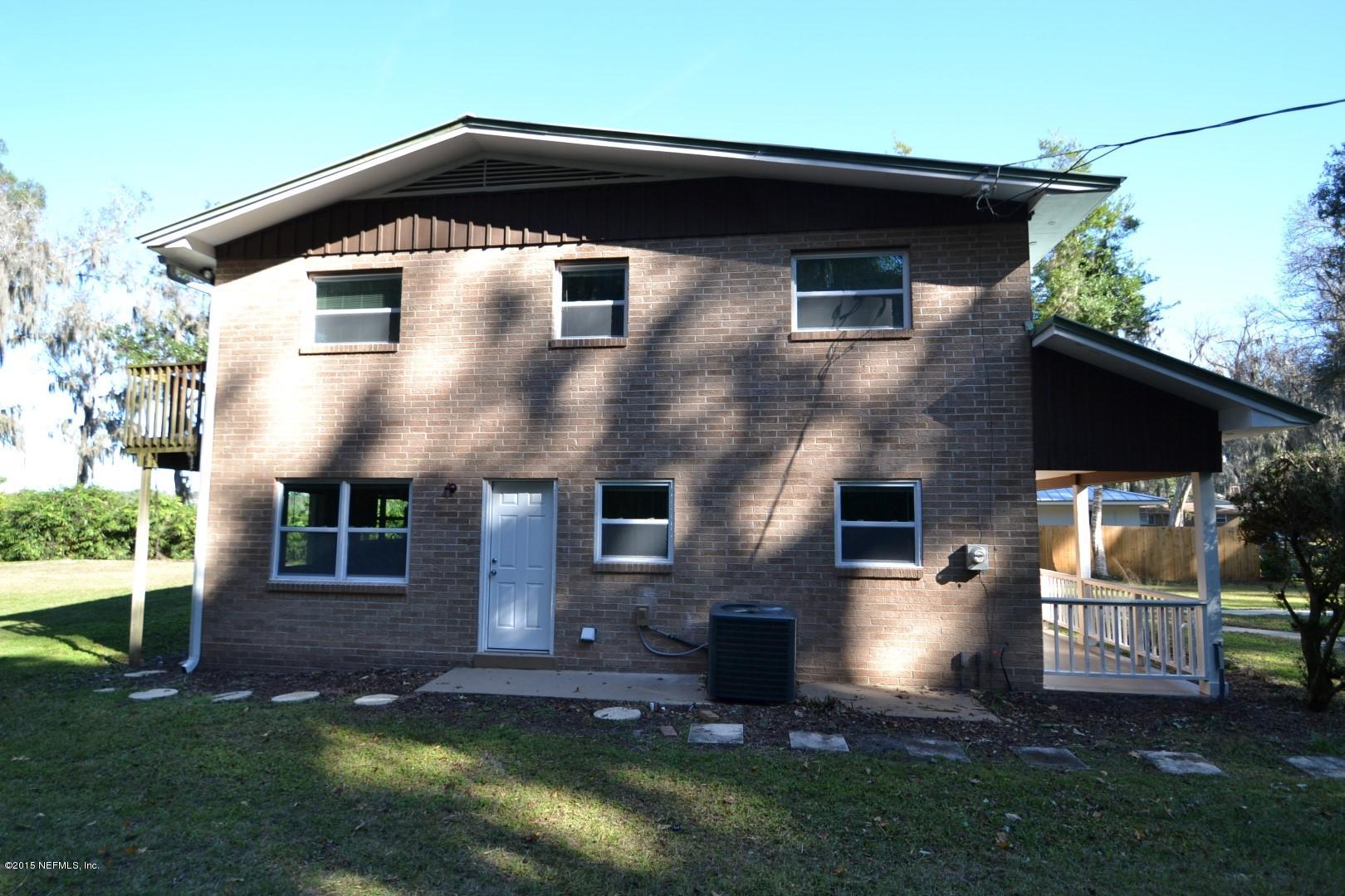 76 Harmony Hall Road Middleburg, FL 32068 - Photo 10 of 67 a front view of a house with a yard