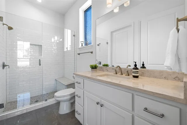 a bedroom with a bed and ceiling fan