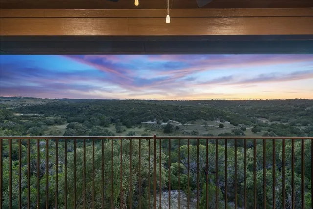 a view of a balcony with a fire pit and a fire pit