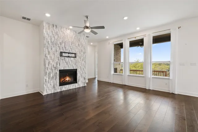 a kitchen with stainless steel appliances granite countertop a refrigerator a sink and a stove