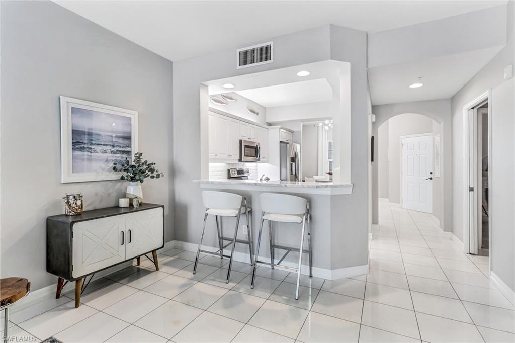 401 Bayfront Place, Unit 3204 Naples, FL 34102 - Photo 4 of 18 Kitchen featuring breakfast bar