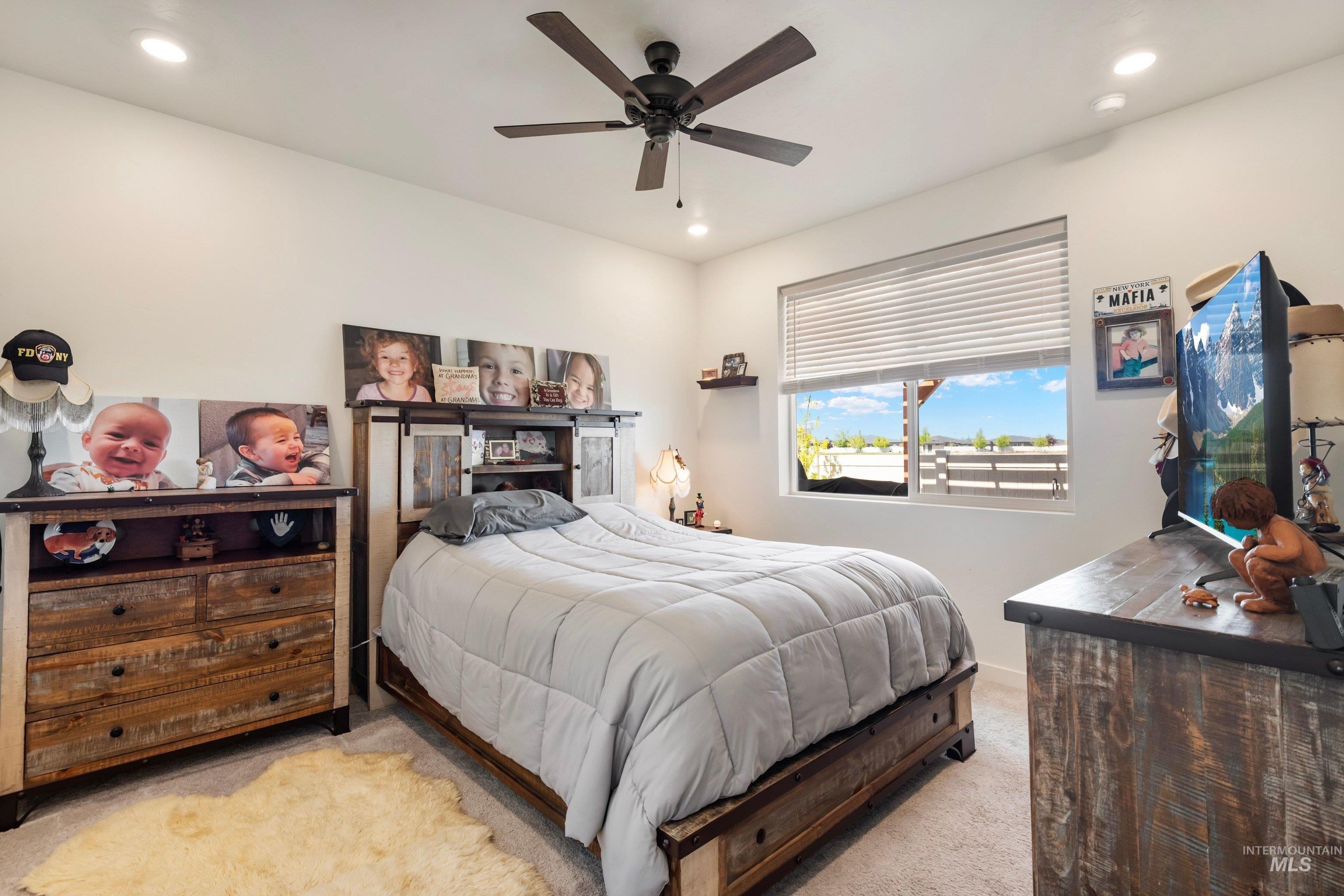 4232 South Graycliff Way Meridian, ID 83642 - Photo 16 of 34 Carpeted room featuring a window with blinds, recessed lighting, and a ceiling fan