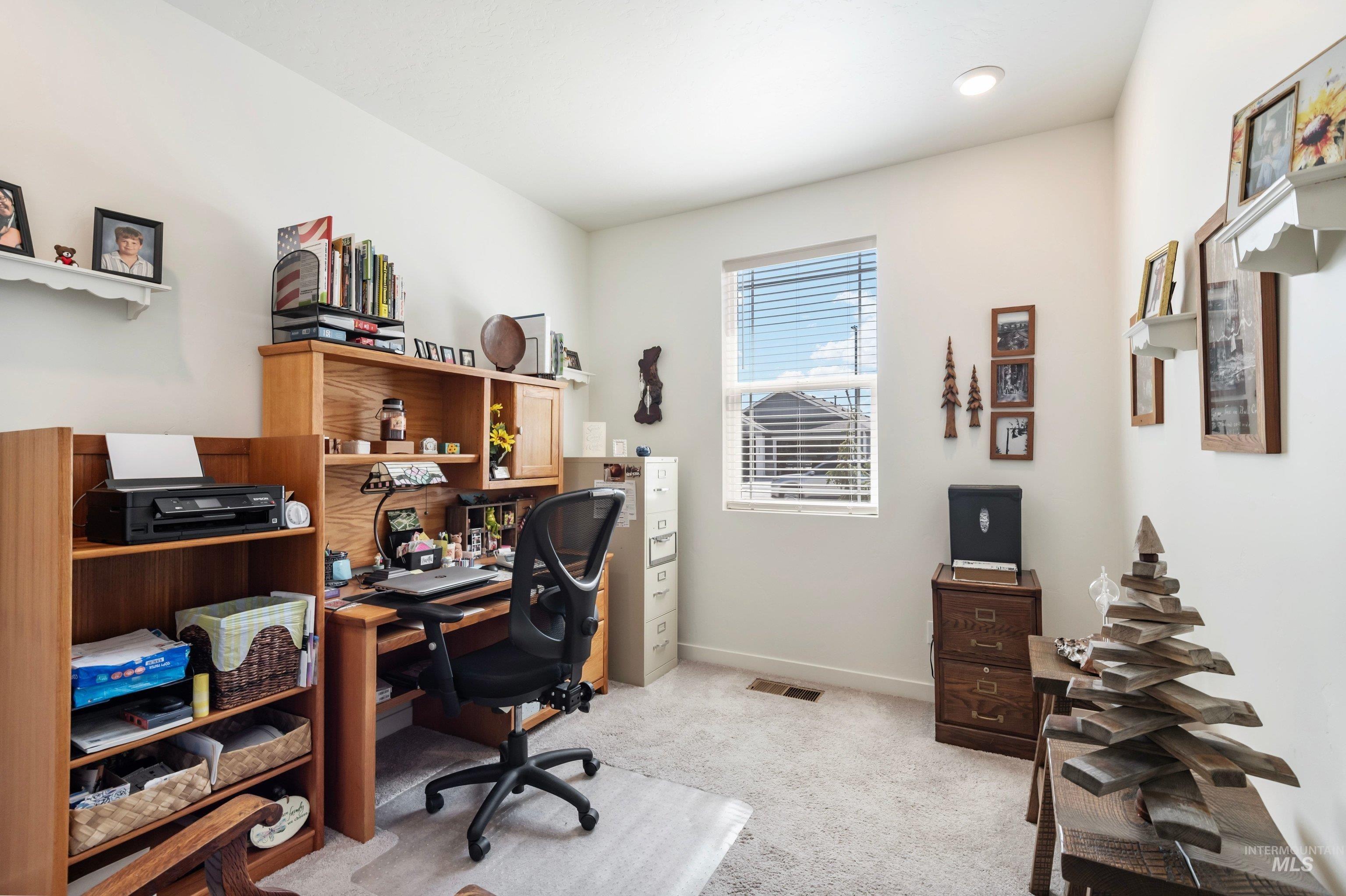 4232 South Graycliff Way Meridian, ID 83642 - Photo 20 of 34 Bright room featuring a window with blinds, recessed lighting, and neutral-toned carpet