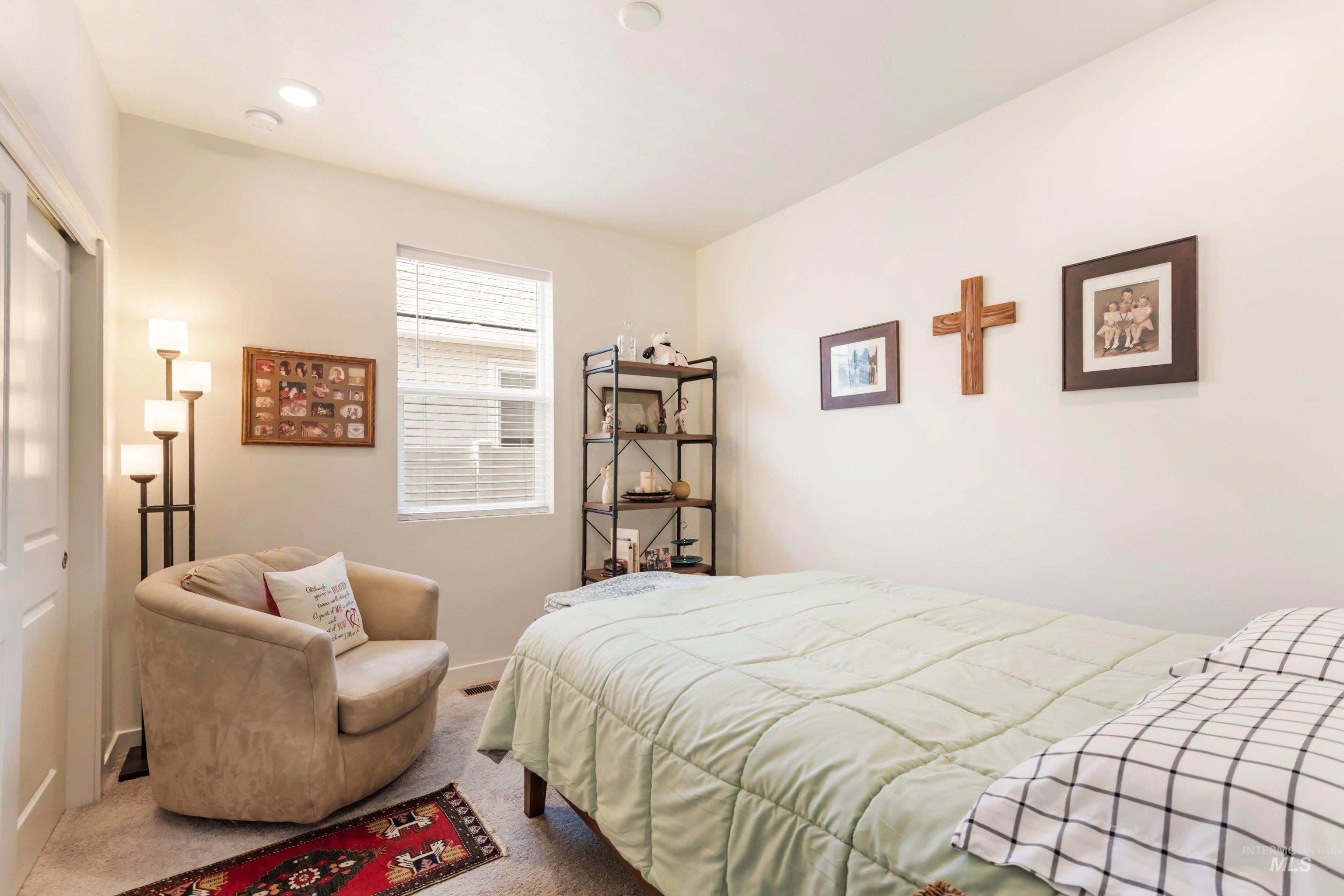 4232 South Graycliff Way Meridian, ID 83642 - Photo 22 of 34 Carpeted bedroom featuring neutral wall tones, recessed lighting, and a window with blinds