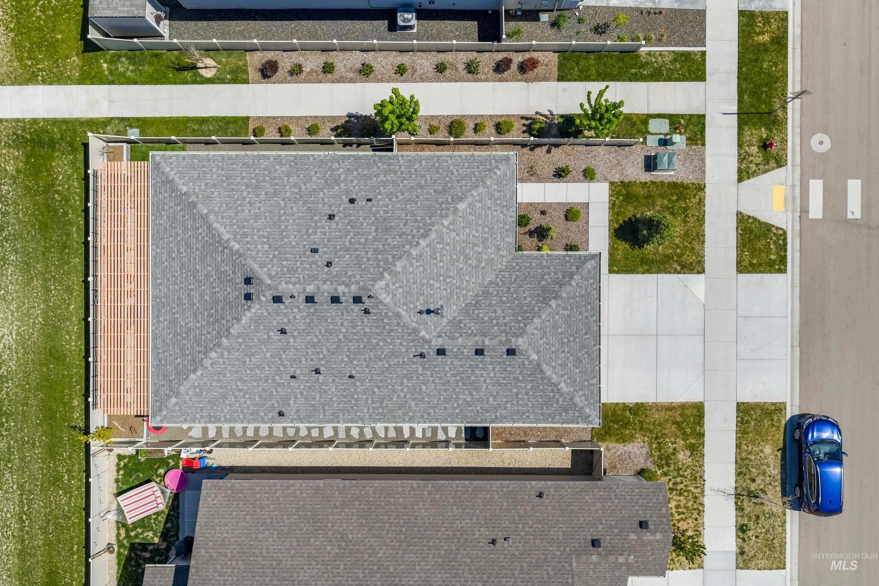 4232 South Graycliff Way Meridian, ID 83642 - Photo 31 of 34 Pitched roof home featuring a pergola, concrete pathways, and established landscaping