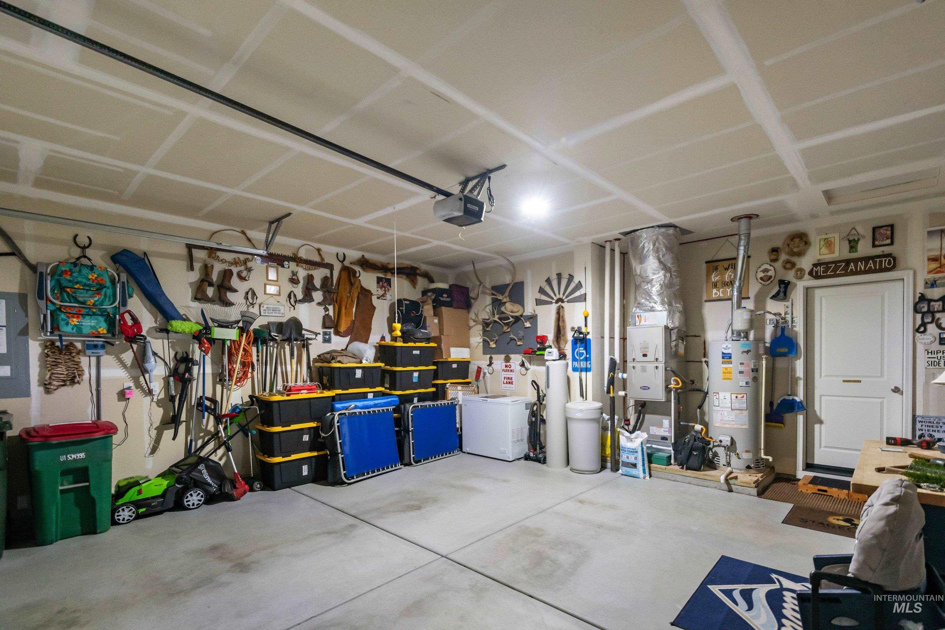 4232 South Graycliff Way Meridian, ID 83642 - Photo 34 of 34 Spacious garage featuring a concrete floor, painted drywall, and overhead lighting