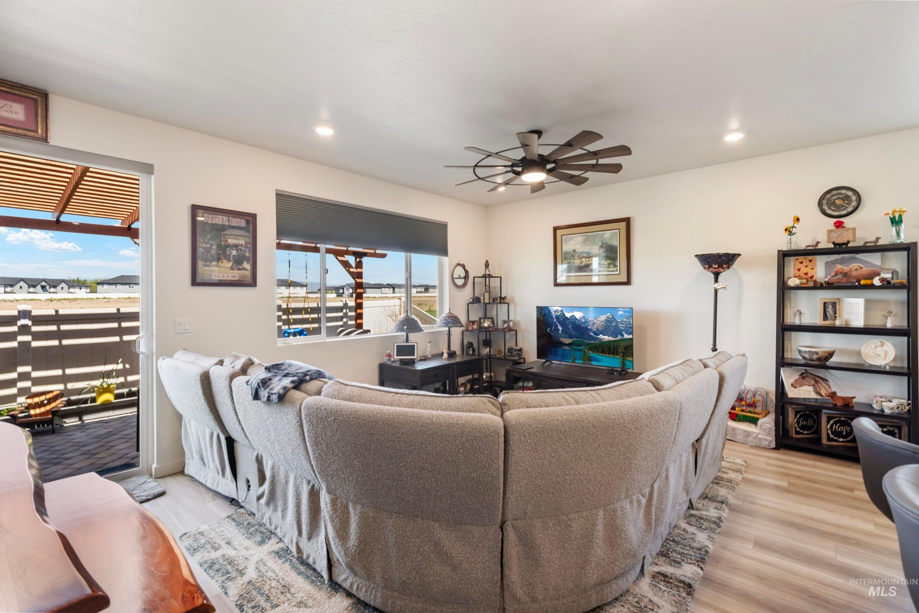 4232 South Graycliff Way Meridian, ID 83642 - Photo 10 of 34 Bright interior space featuring light-toned walls and wood-finish flooring