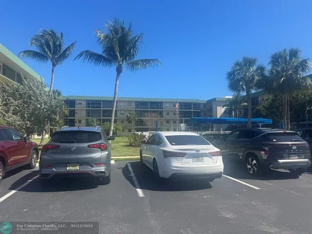 a view of a street with couches and a fire pit