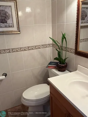 a bathroom with a toilet and a sink