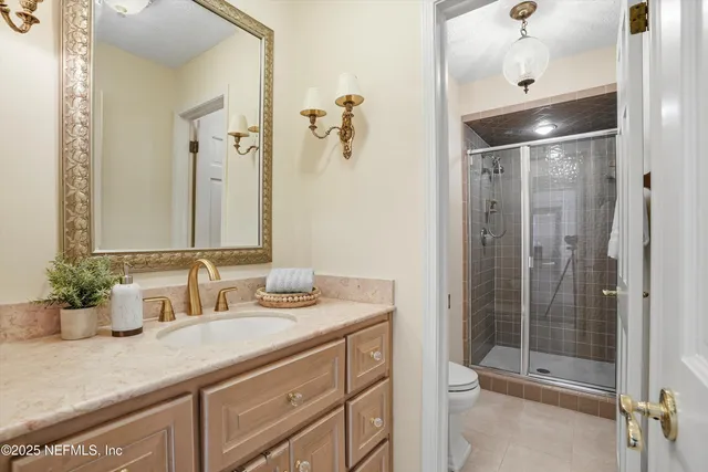 a spacious bedroom with a bed and a large window with the outer view