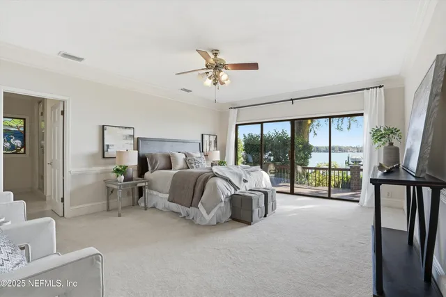 a bedroom with bed couch and window