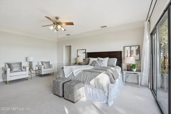 a bathroom with double vanity and a mirror