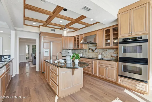 a kitchen with a sink and a stove