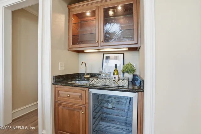 a bathroom with a sink mirror and toilet