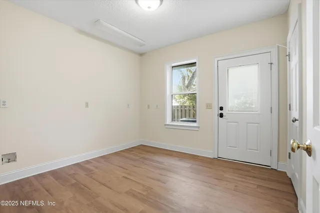 a bedroom with a bed and a chair