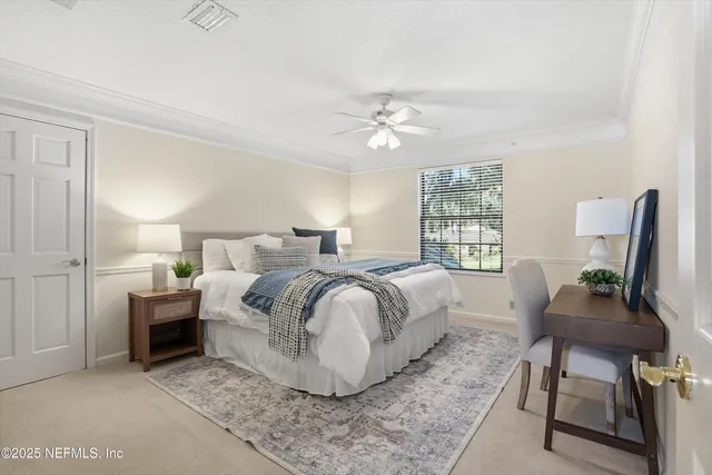 an empty room with a ceiling fan and windows