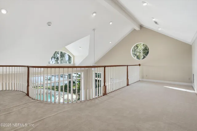 a view of a hallway with staircase