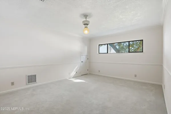a picture of a bathroom with a bathtub