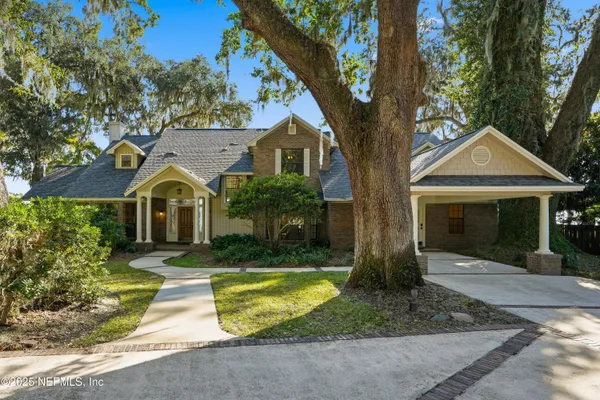 a balcony with wooden floor and city view