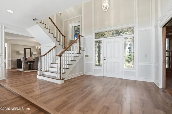 a bathroom with a shower sink and mirror