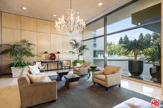 a view of a patio with couches and potted plants