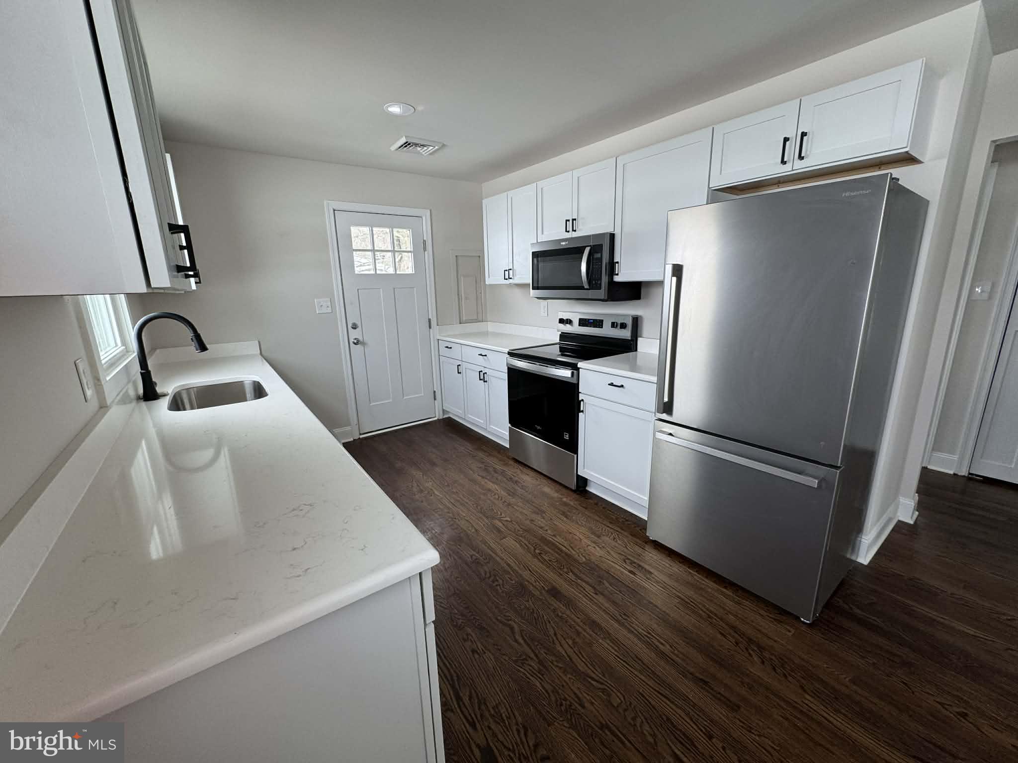 183 Knights Corner Road Elkton, MD 21921 - Photo 3 of 8 a kitchen with a refrigerator a stove a sink dishwasher a microwave oven with cabinets