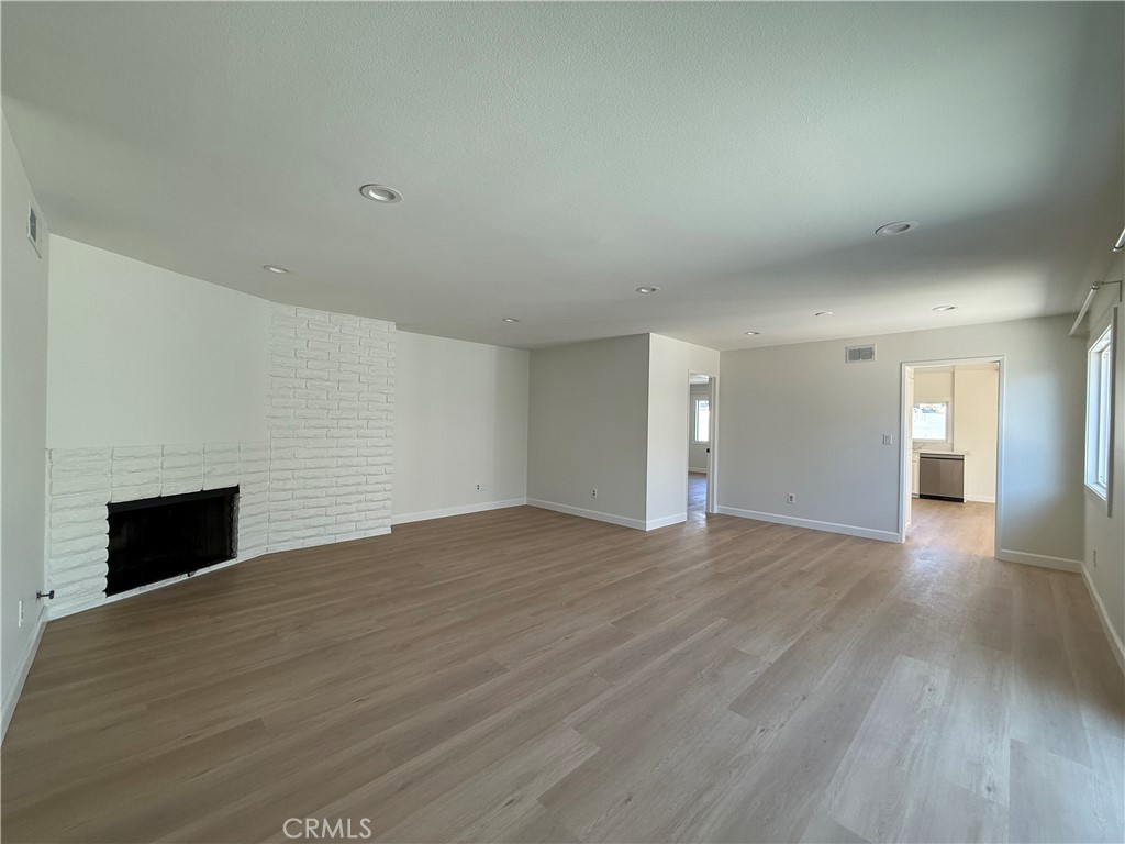 6441 St Paul Circle, Unit A Huntington Beach, CA 92647 - Photo 2 of 13 a view of empty room with wooden floor