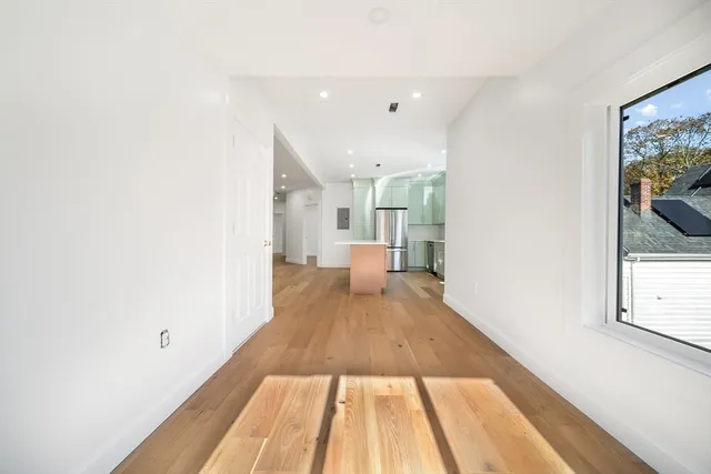 a view of room with wooden floor