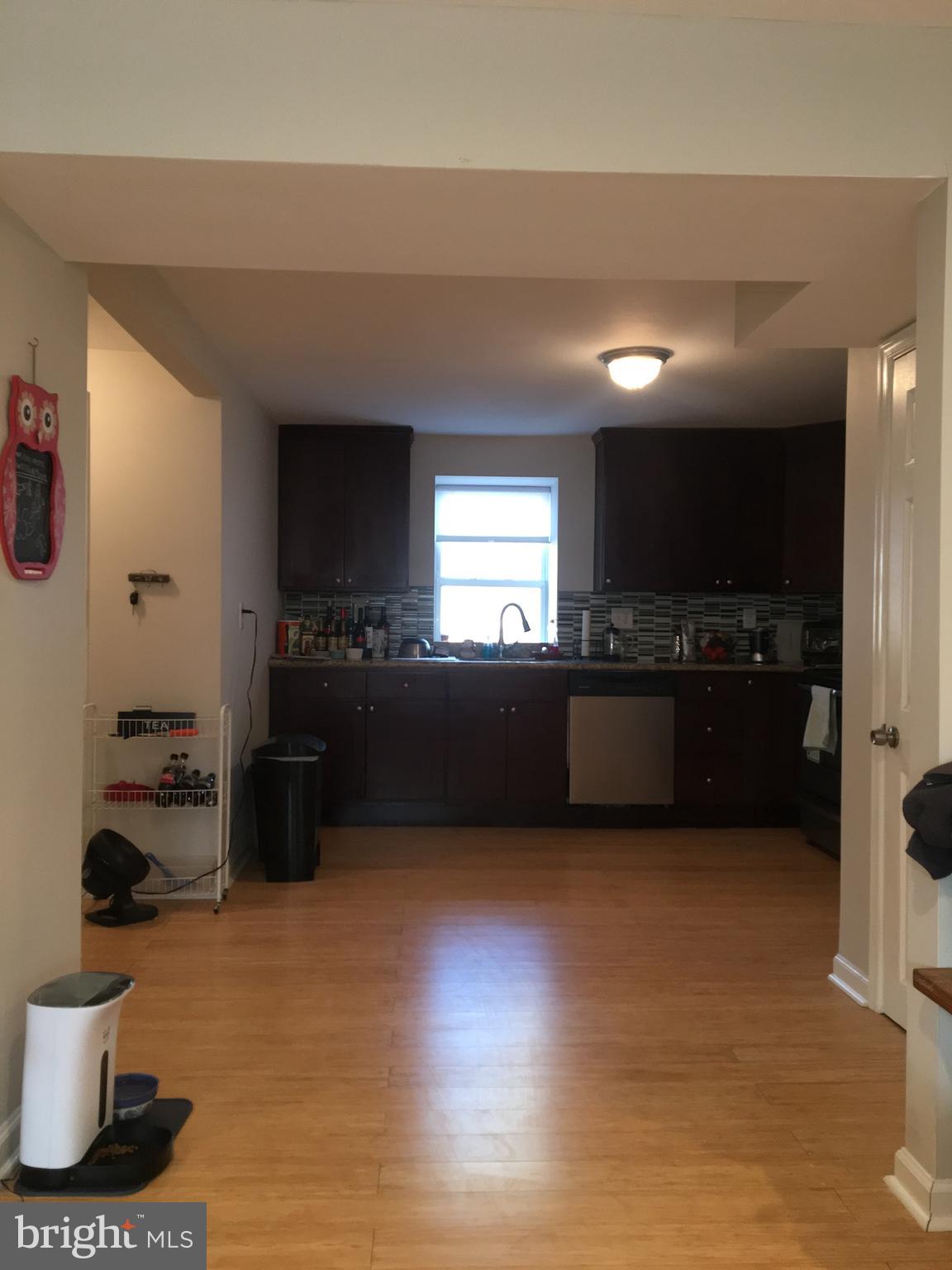 4203 Main Street, Unit 2 Philadelphia, PA 19127 - Photo 4 of 16 a kitchen with a sink and a stove top oven