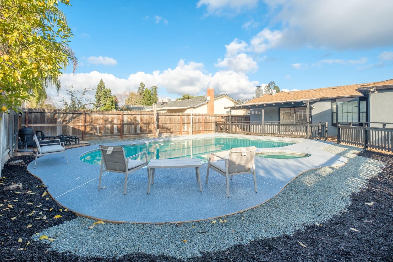 2248 Sunnyside Avenue Clovis, CA 93612 - Photo 21 of 25 a view of a house with a swimming pool and sitting area