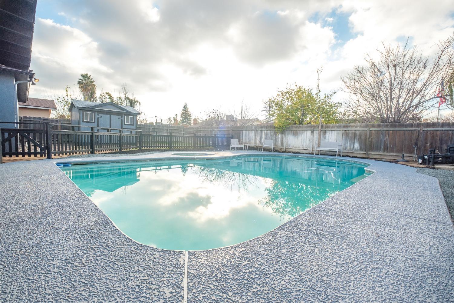 2248 Sunnyside Avenue Clovis, CA 93612 - Photo 23 of 25 a view of a swimming pool with a yard