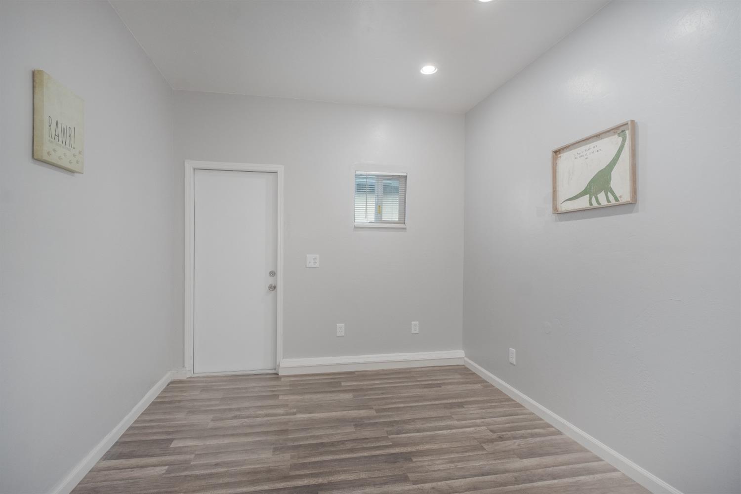 2248 Sunnyside Avenue Clovis, CA 93612 - Photo 7 of 25 a view of an empty room with wooden floor
