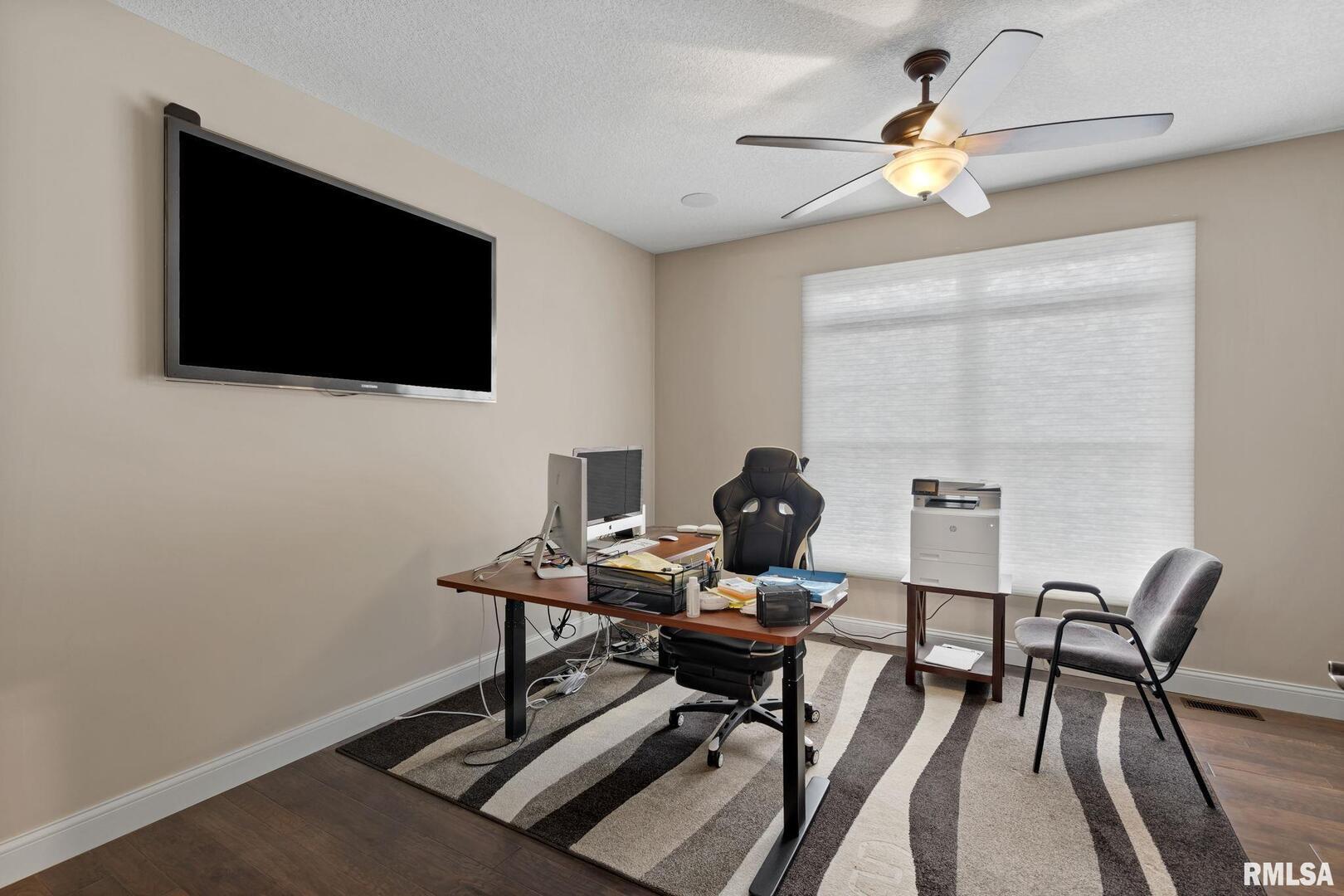 1422 Racine Court Davenport, IA 52804 - Photo 25 of 53 a work room with furniture and a flat screen tv