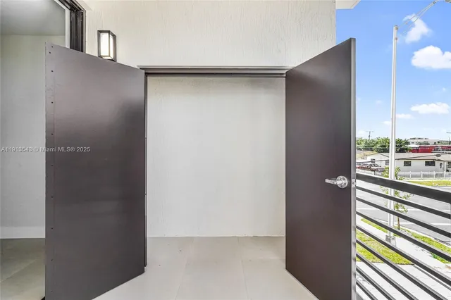 a view of a closet area with living room