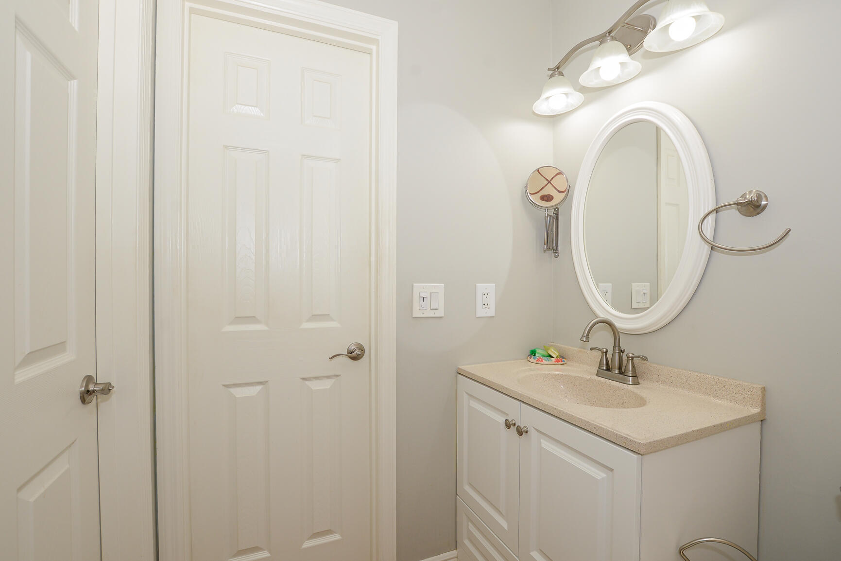 2123 Southeast Wayne Road Stuart, FL 34994 - Photo 16 of 24 a bathroom with a sink and a mirror