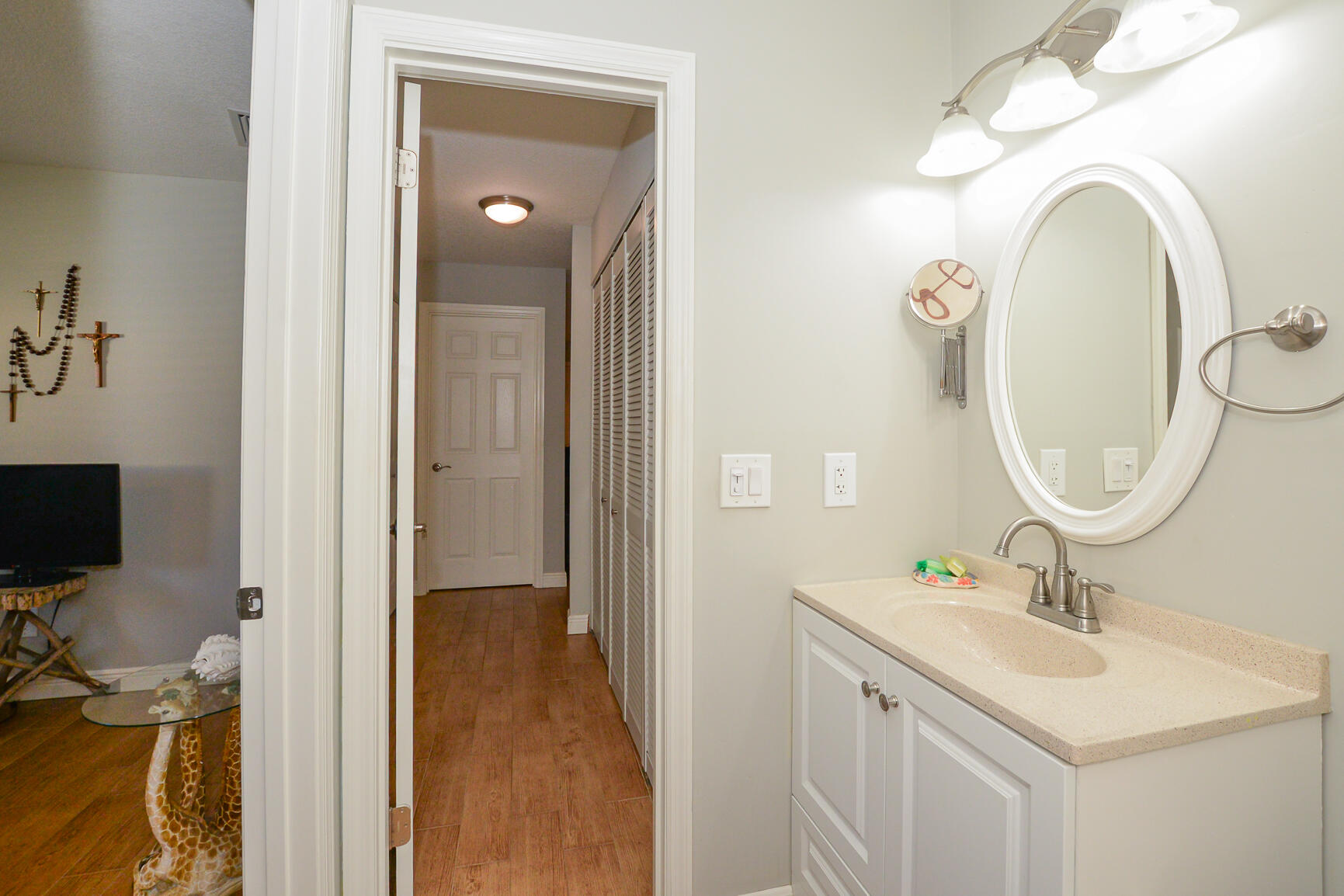 2123 Southeast Wayne Road Stuart, FL 34994 - Photo 17 of 24 a bathroom with a sink a vanity and a mirror