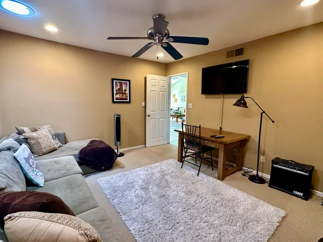 a bed room with a bed and a chandelier