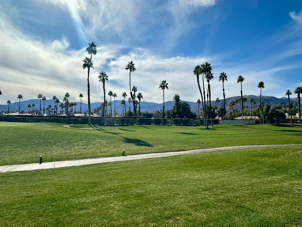 a view of a golf course with a lake view