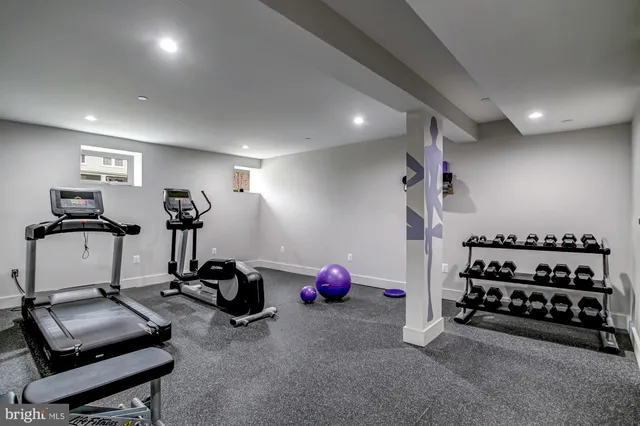 a room with gym equipment and gym equipment