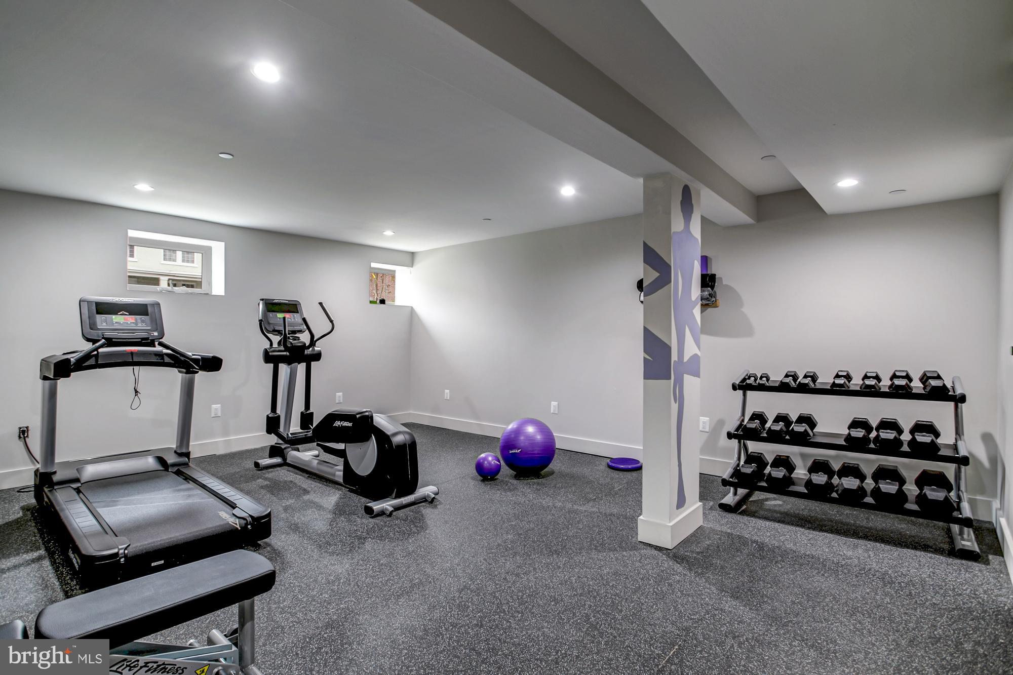 839 Kennedy Street Northwest, Unit 105 Washington, DC 20011 - Photo 16 of 21 a room with gym equipment and gym equipment